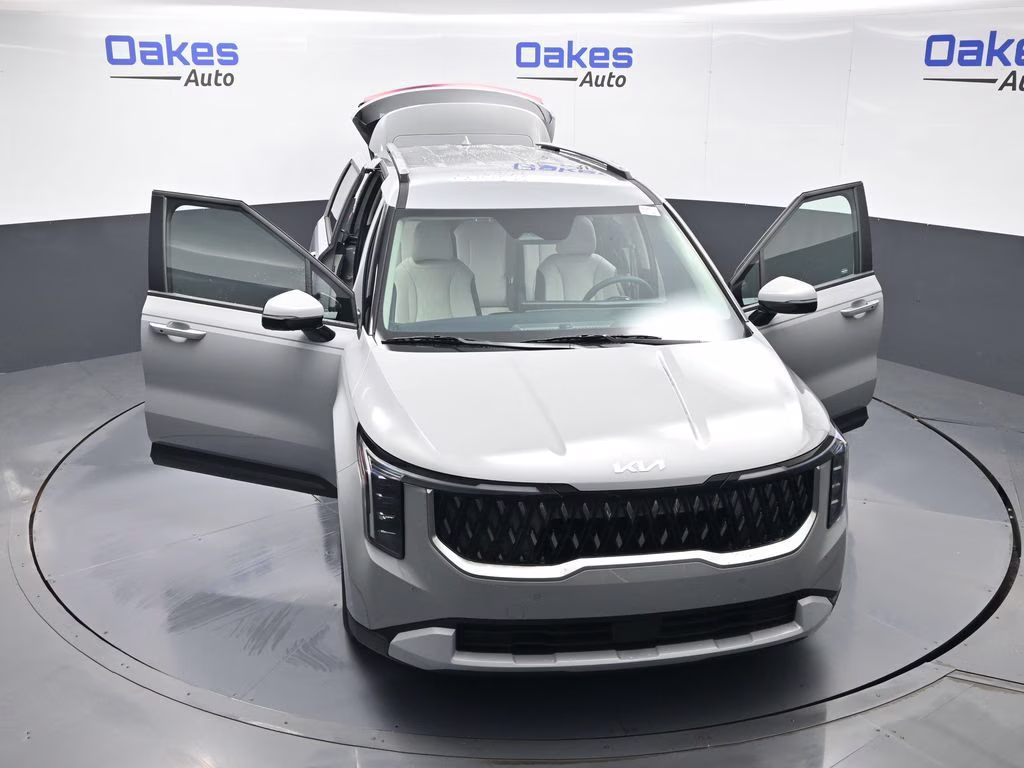 2026 Ceramic Silver Kia Carnival EX FWD Van