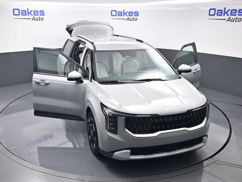 2026 Ceramic Silver Kia Carnival EX FWD Van