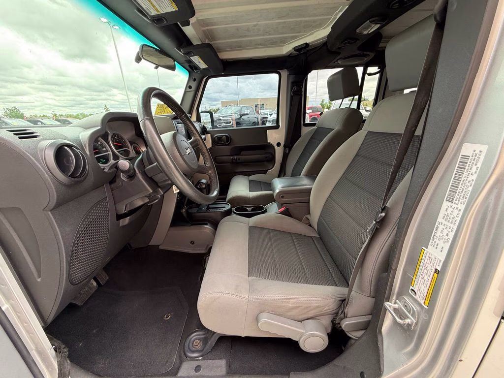 2010 Bright Silver Metallic Clearcoat Jeep Wrangler Unlimited Sport 4X4 SUV