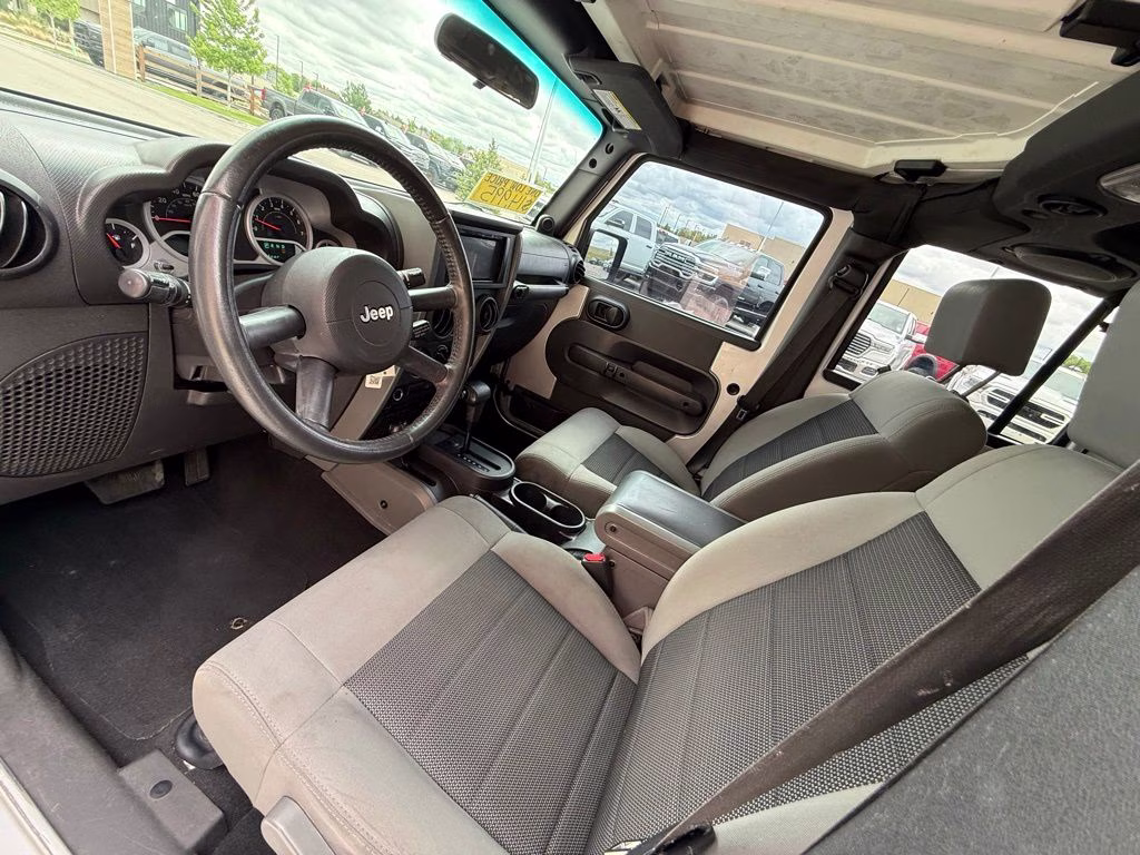 2010 Bright Silver Metallic Clearcoat Jeep Wrangler Unlimited Sport 4X4 SUV