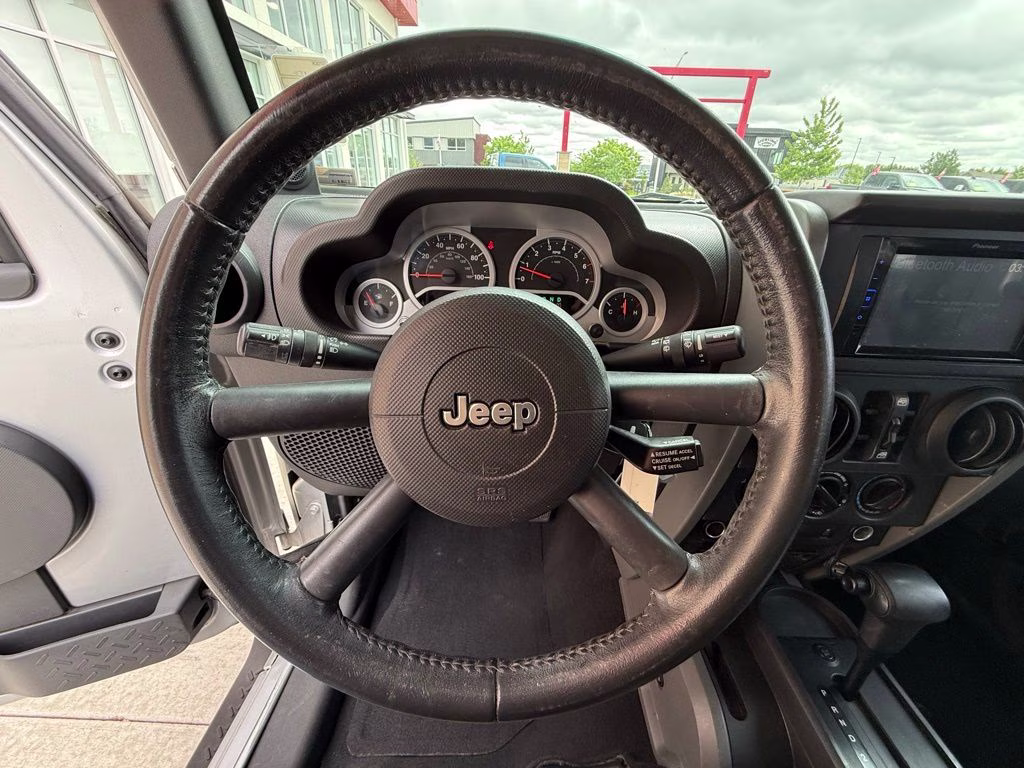 2010 Bright Silver Metallic Clearcoat Jeep Wrangler Unlimited Sport 4X4 SUV