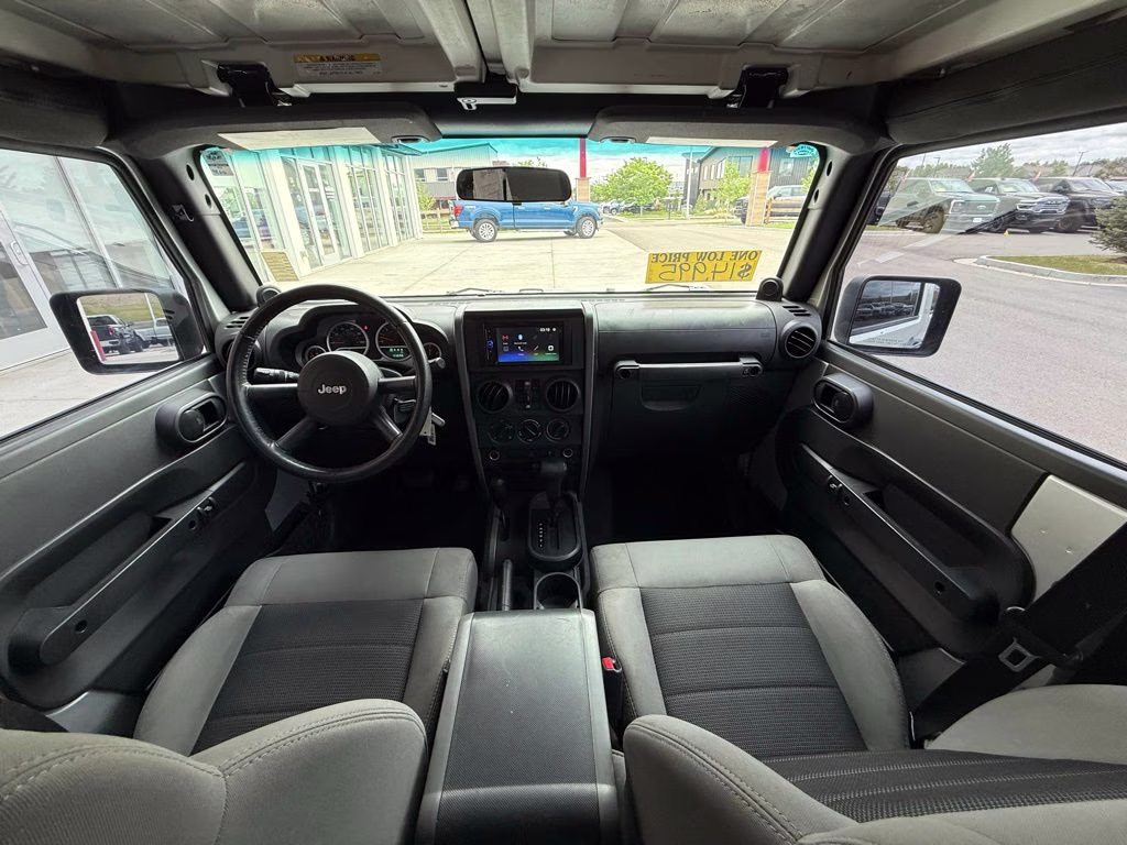 2010 Bright Silver Metallic Clearcoat Jeep Wrangler Unlimited Sport 4X4 SUV