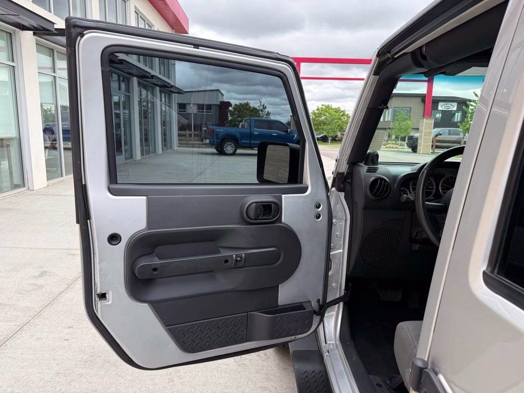 2010 Bright Silver Metallic Clearcoat Jeep Wrangler Unlimited Sport 4X4 SUV