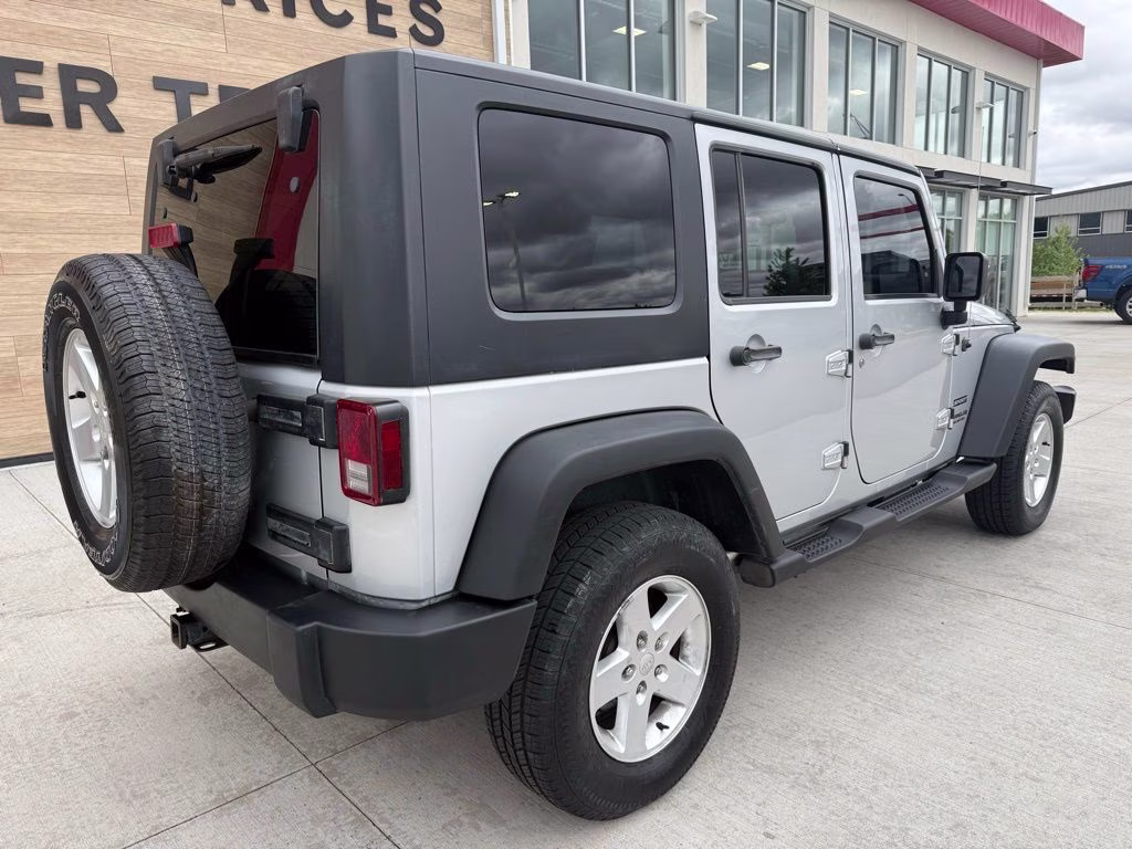 2010 Bright Silver Metallic Clearcoat Jeep Wrangler Unlimited Sport 4X4 SUV