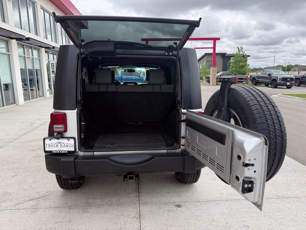 2010 Bright Silver Metallic Clearcoat Jeep Wrangler Unlimited Sport 4X4 SUV
