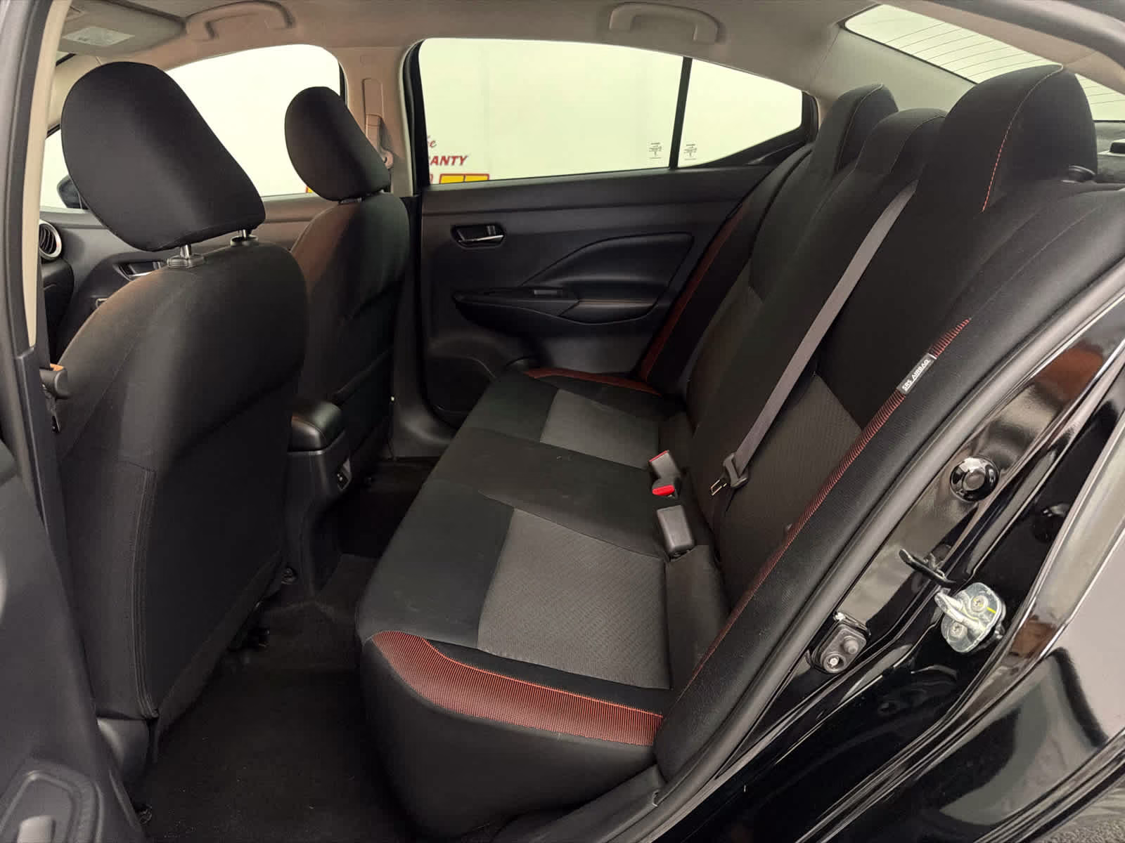 2023 Super Black Nissan Versa SR FWD Sedan