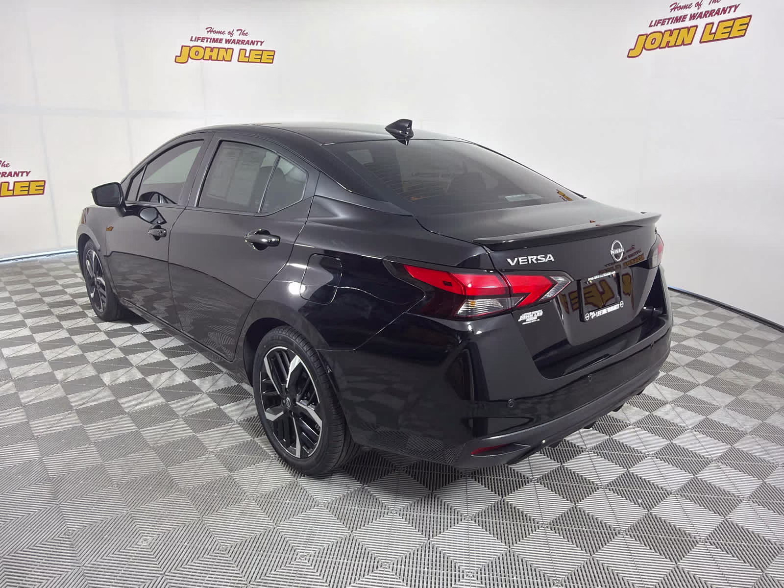 2023 Super Black Nissan Versa SR FWD Sedan
