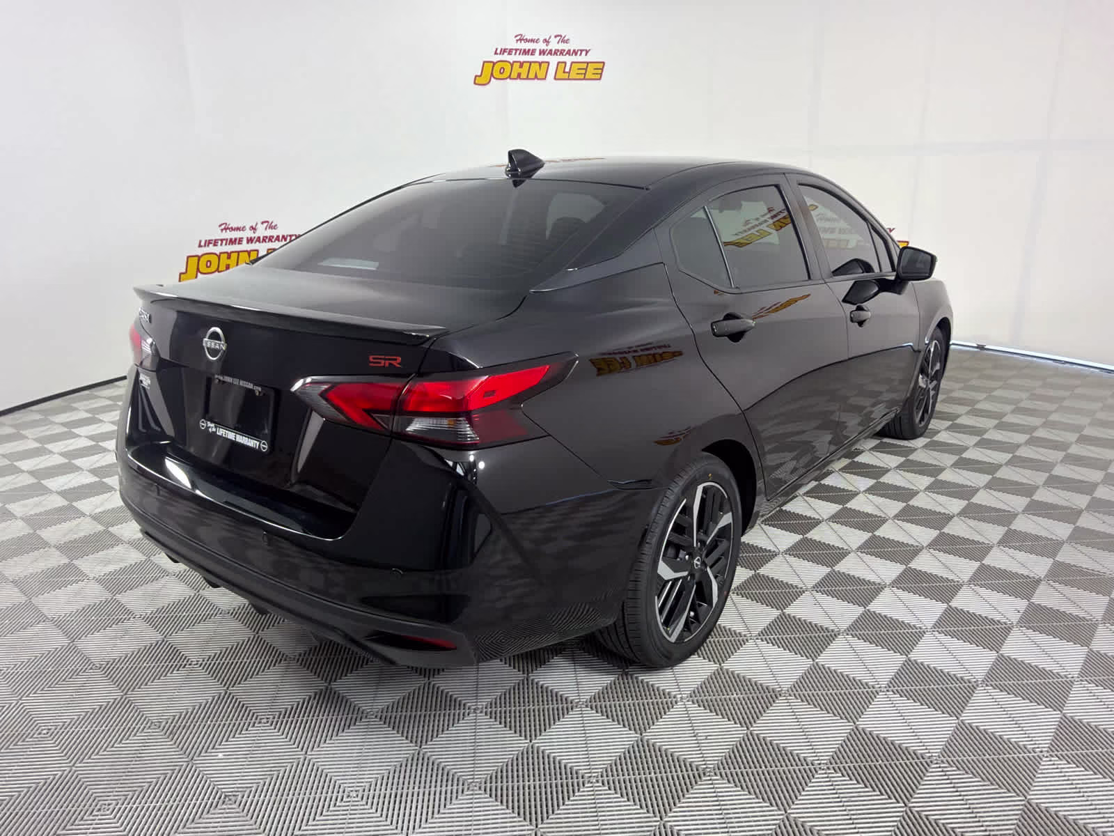 2023 Super Black Nissan Versa SR FWD Sedan