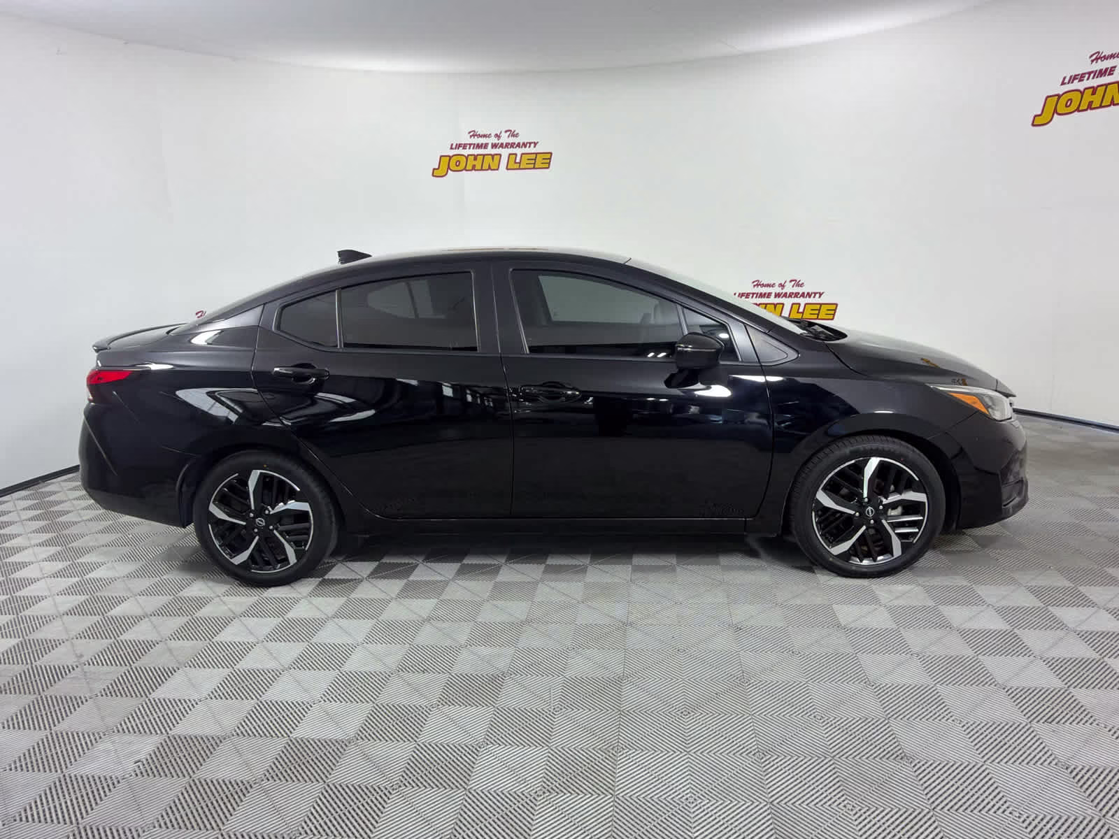 2023 Super Black Nissan Versa SR FWD Sedan