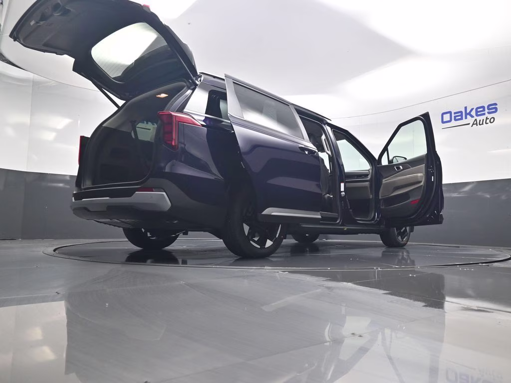 2026 Deep Chroma Blue Kia Carnival EX FWD Van