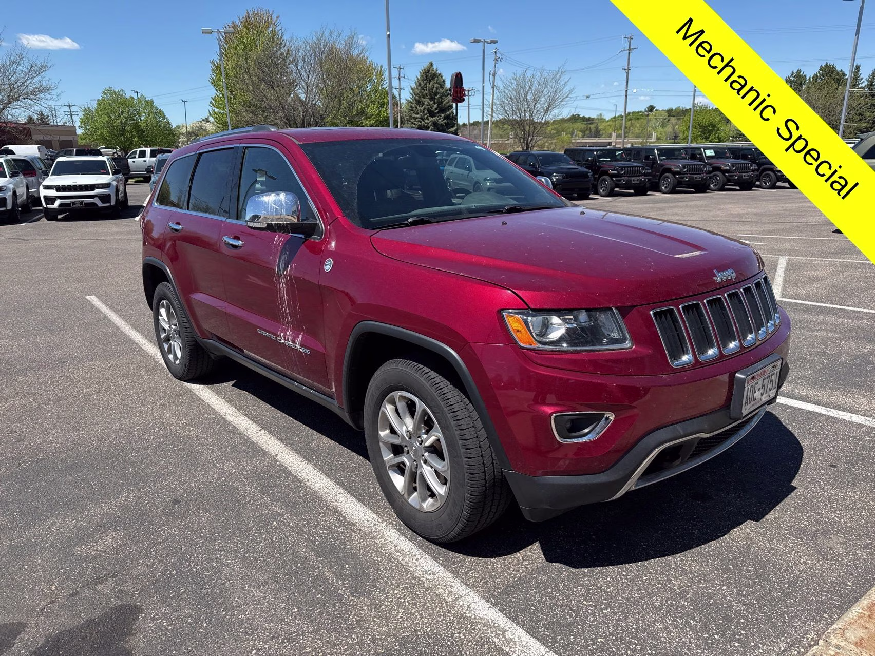 2015 Deep Cherry Red Crystal Pearlcoat Jeep Grand Cherokee Limited 4X4 SUV