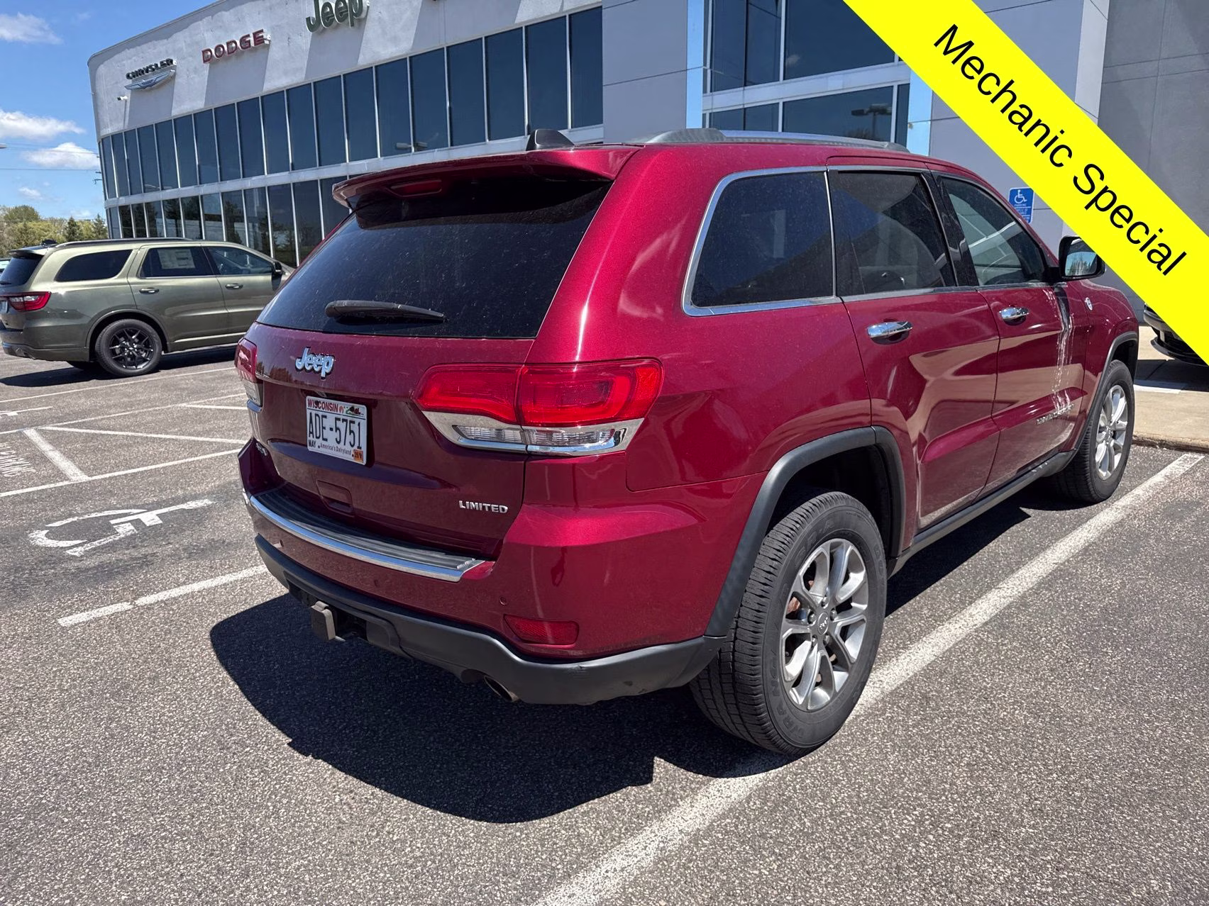 2015 Deep Cherry Red Crystal Pearlcoat Jeep Grand Cherokee Limited 4X4 SUV