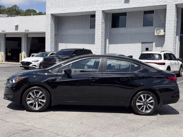 2024 Super Black Metallic Nissan Versa 1.6 SV FWD Sedan
