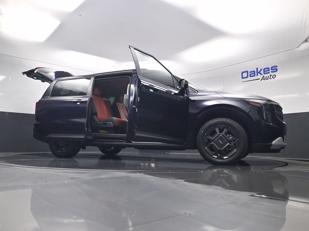 2026 Deep Chroma Blue Kia Carnival Hybrid EX FWD Van