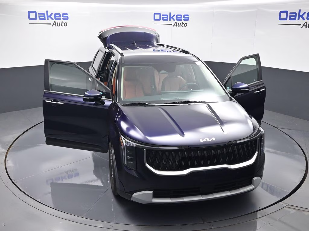 2026 Deep Chroma Blue Kia Carnival Hybrid EX FWD Van