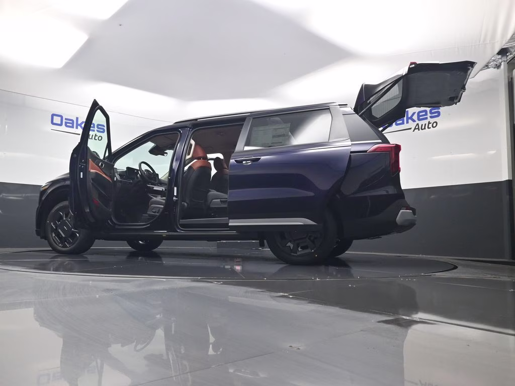 2026 Deep Chroma Blue Kia Carnival Hybrid EX FWD Van