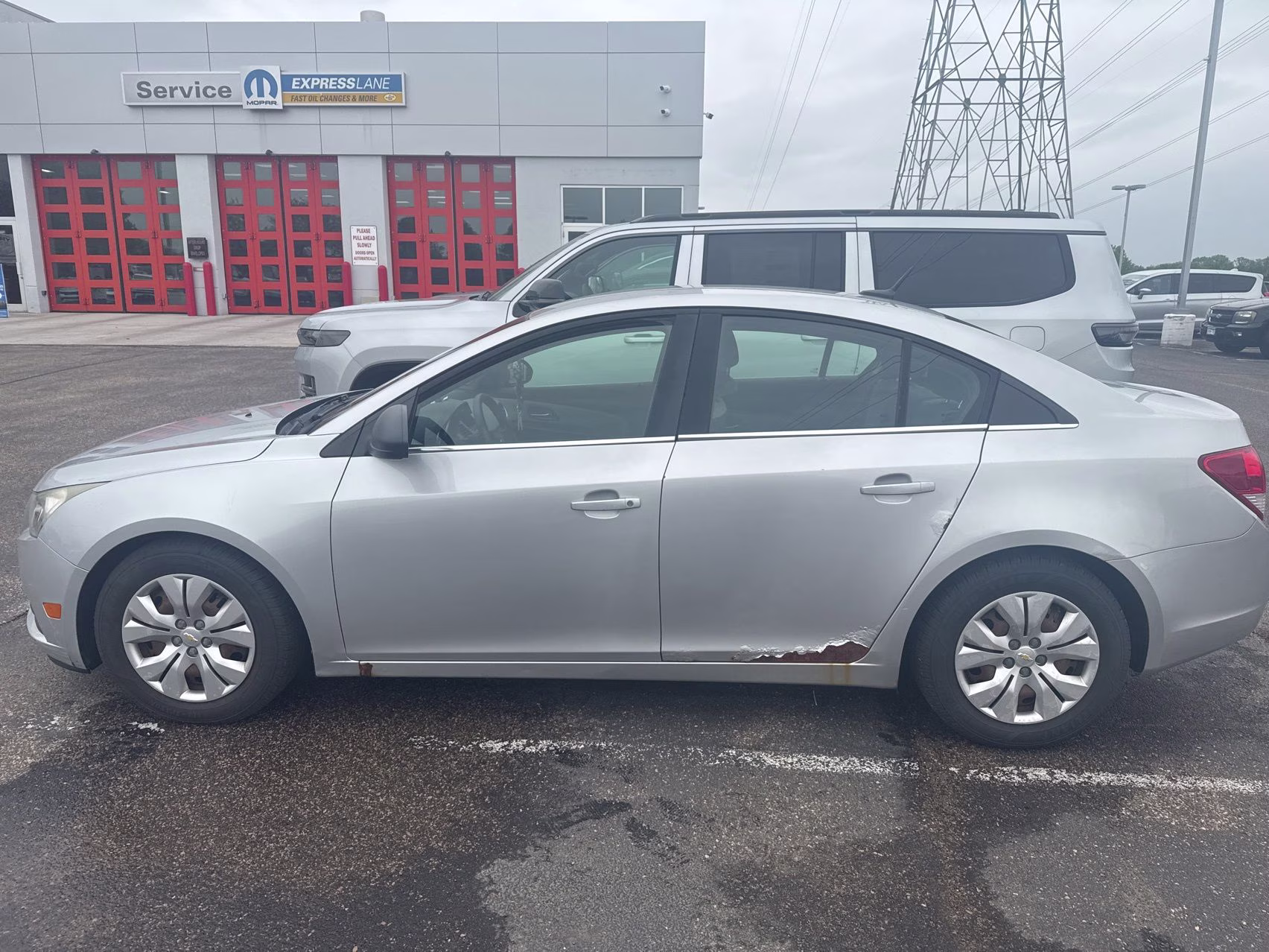 2012 Silver Ice Metallic Chevrolet Cruze LS FWD Sedan