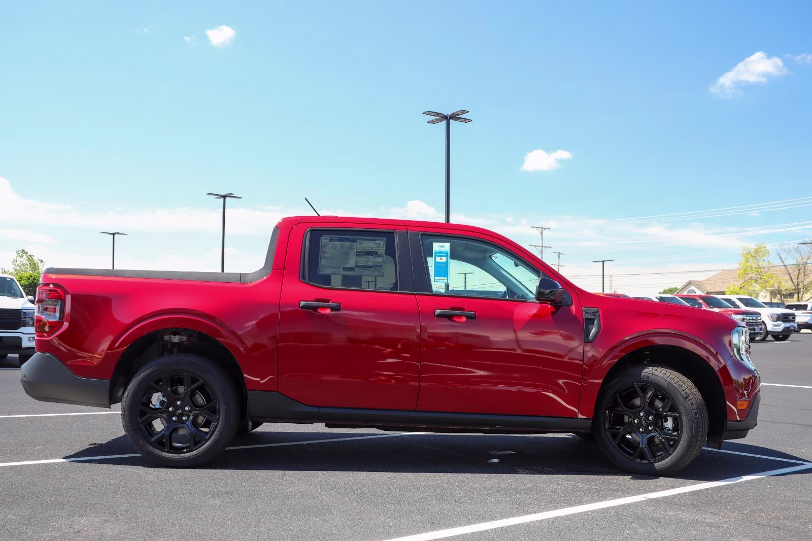 2026 Ruby Red Metallic Tinted Clearcoat Ford Maverick XLT AWD Truck