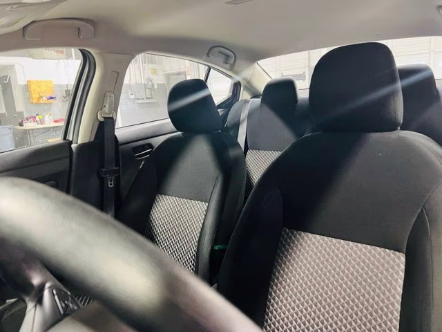 2024 Brilliant Silver Metallic Nissan Versa 1.6 S FWD Sedan