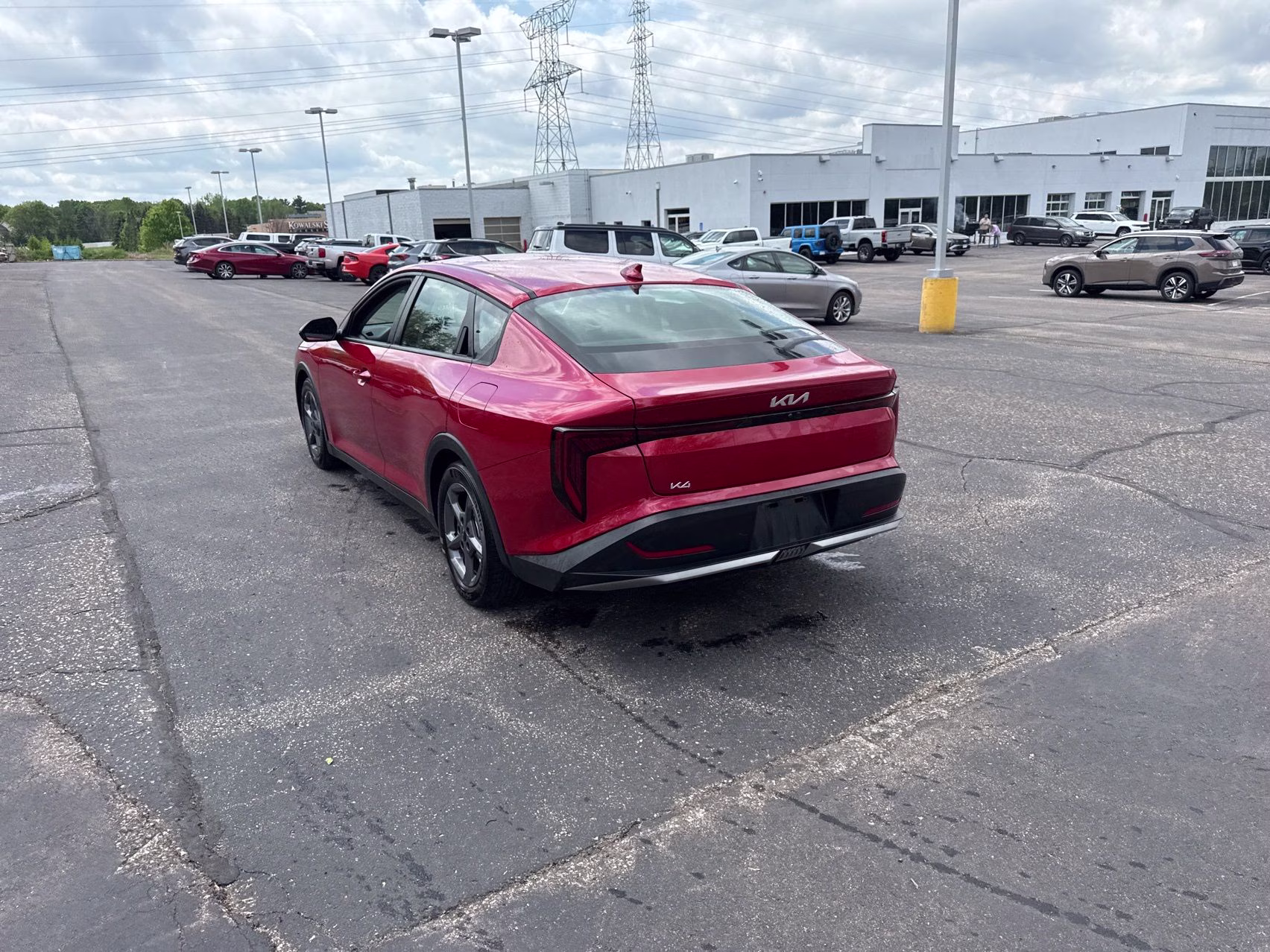 2025 Currant Red Kia K4 LXS FWD Sedan