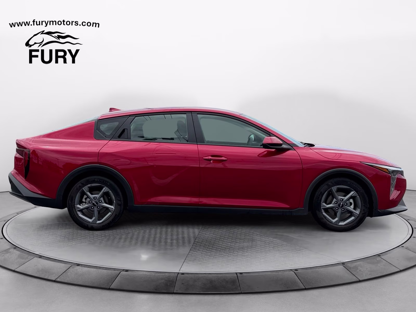 2025 Currant Red Kia K4 LXS FWD Sedan