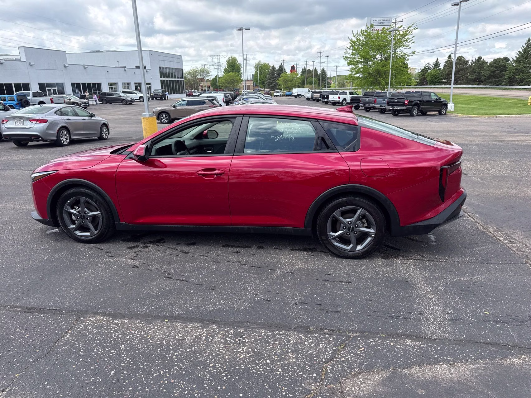 2025 Currant Red Kia K4 LXS FWD Sedan