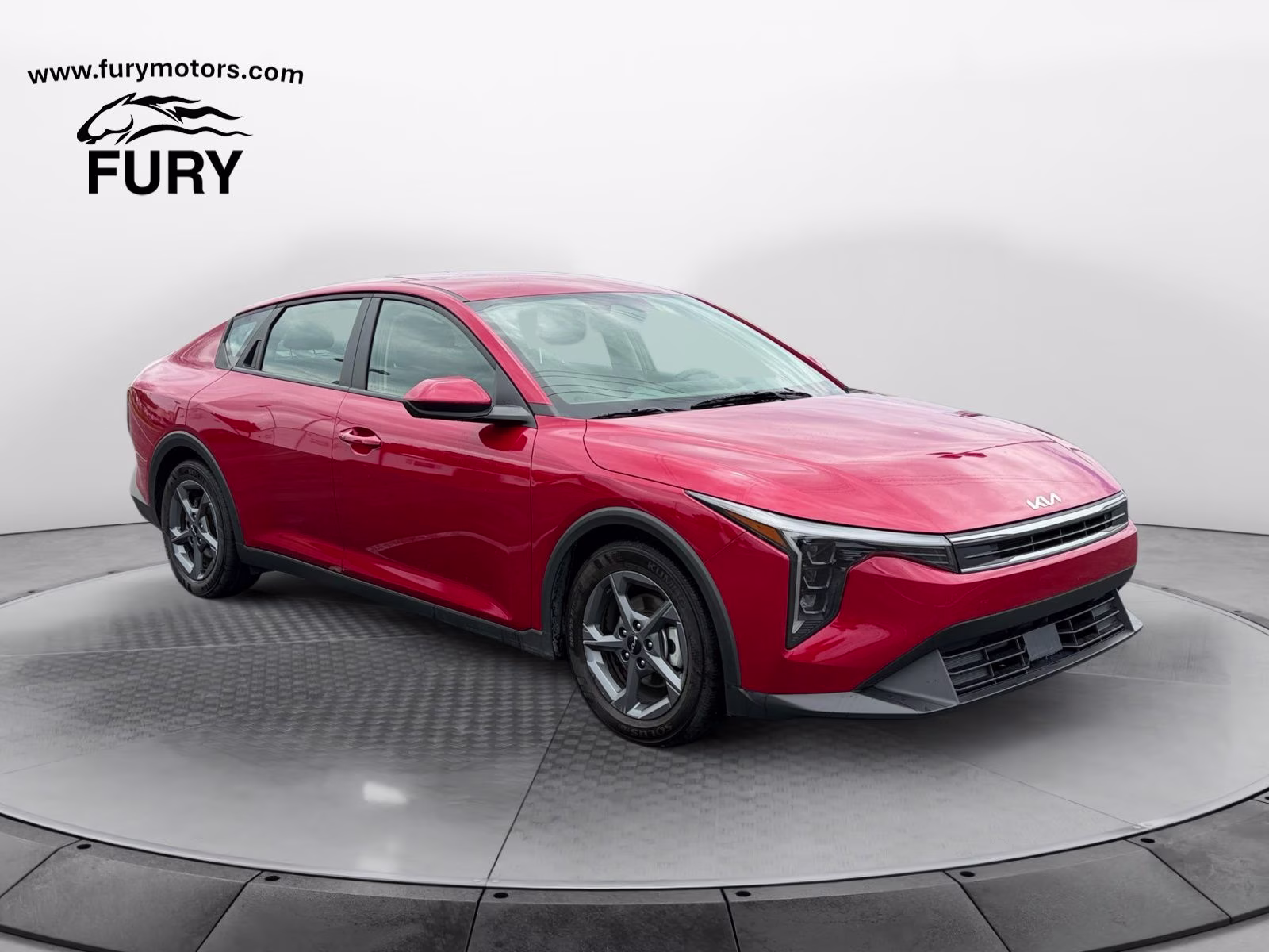 2025 Currant Red Kia K4 LXS FWD Sedan