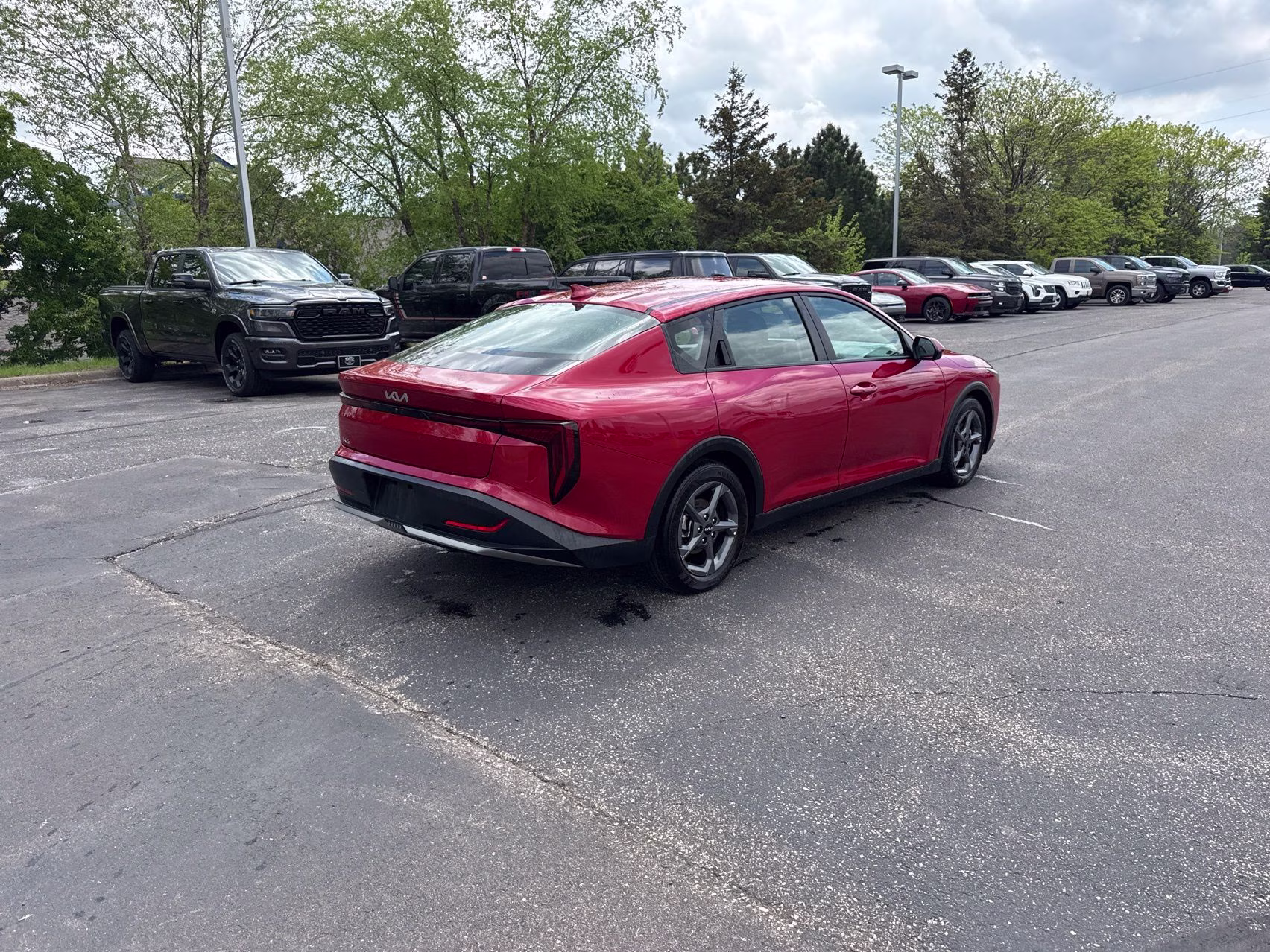 2025 Currant Red Kia K4 LXS FWD Sedan