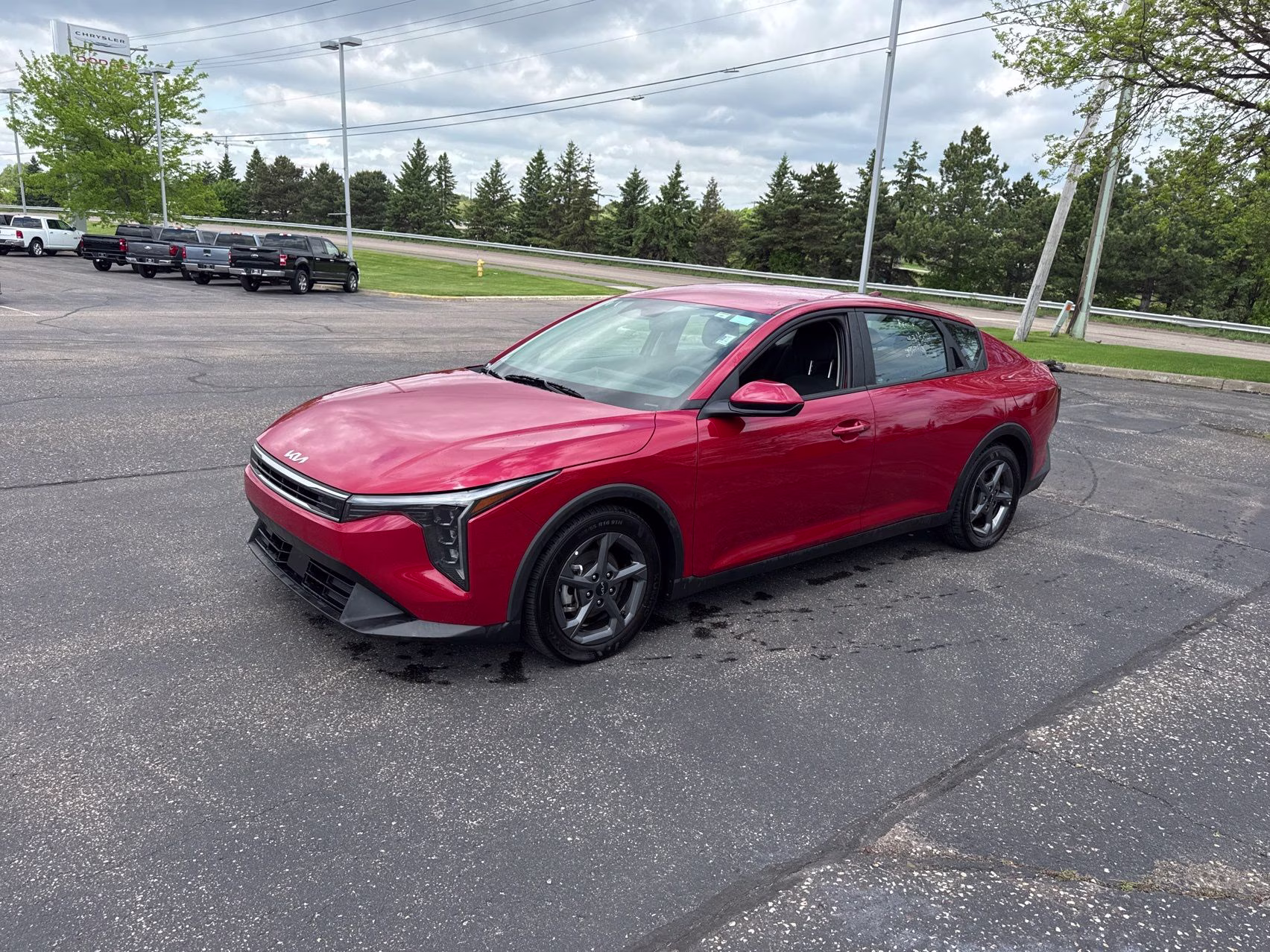 2025 Currant Red Kia K4 LXS FWD Sedan