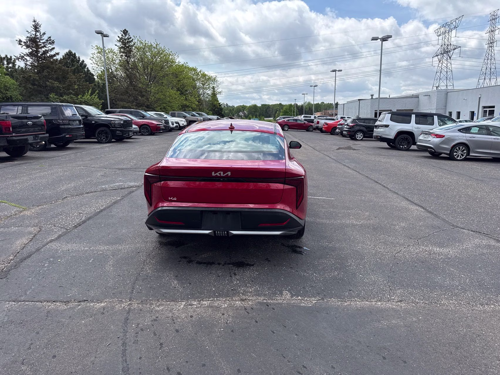 2025 Currant Red Kia K4 LXS FWD Sedan