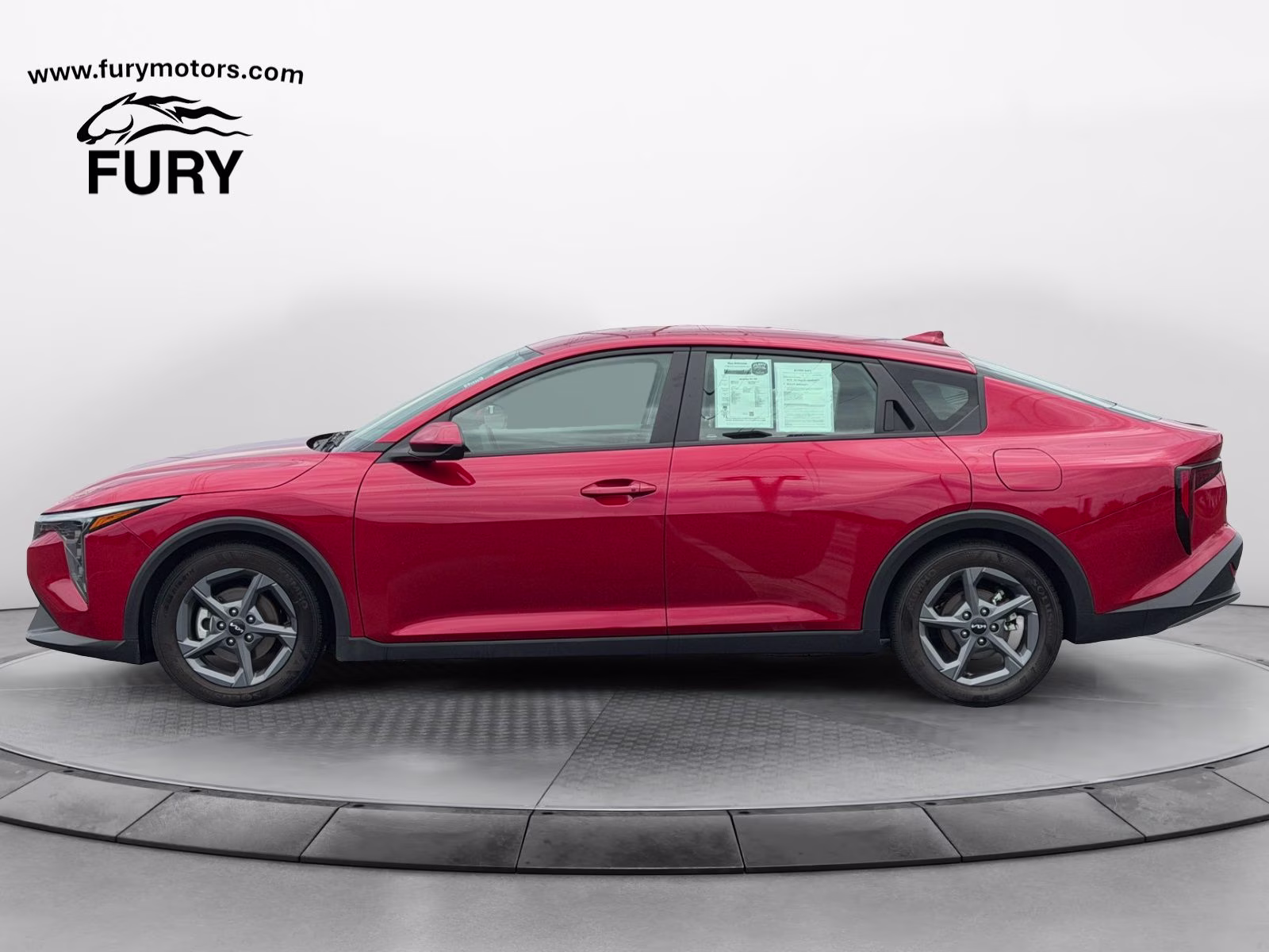 2025 Currant Red Kia K4 LXS FWD Sedan
