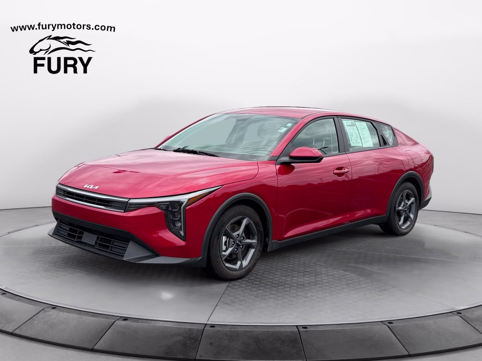 2025 Currant Red Kia K4 LXS FWD Sedan