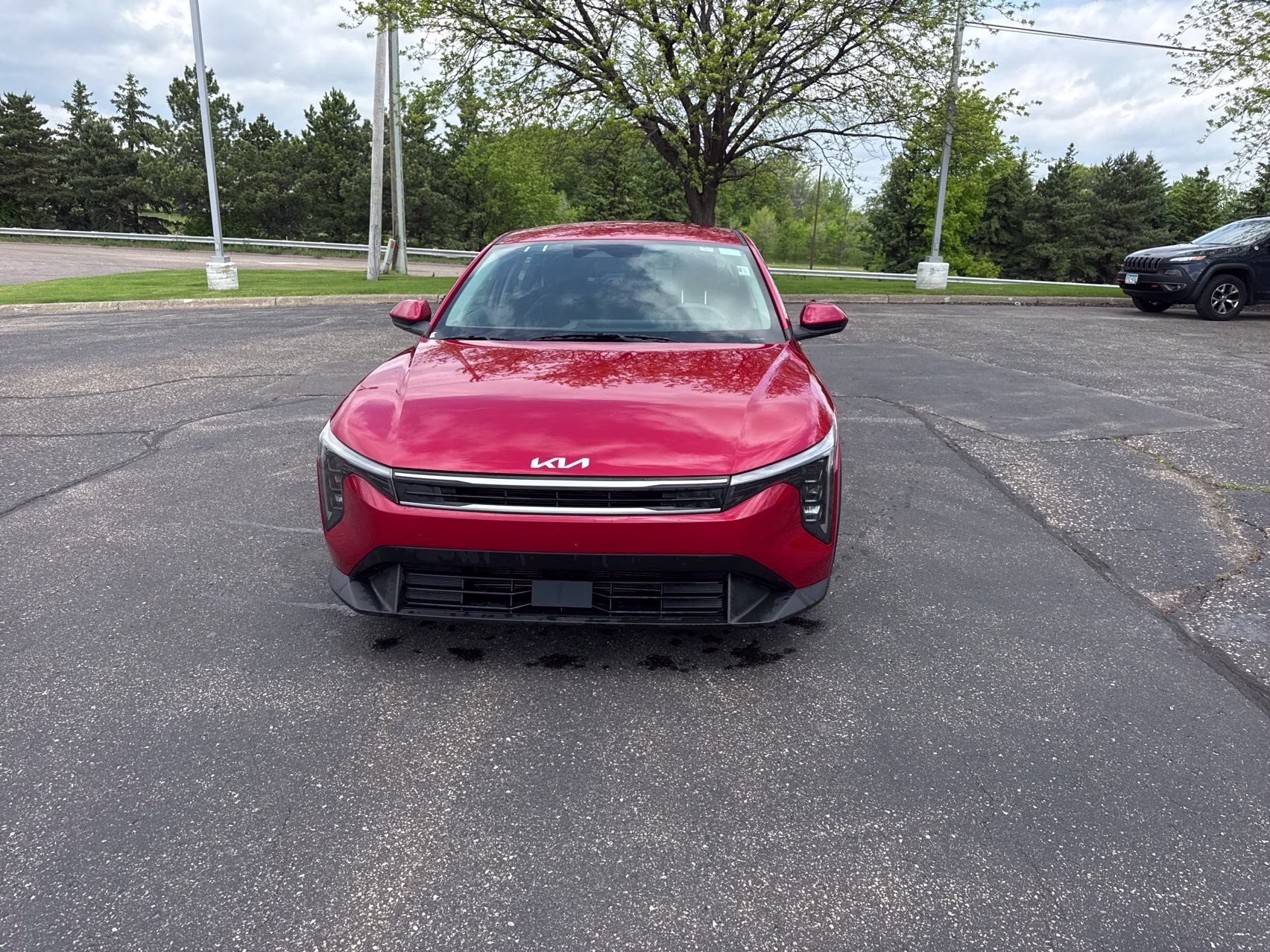 2025 Currant Red Kia K4 LXS FWD Sedan