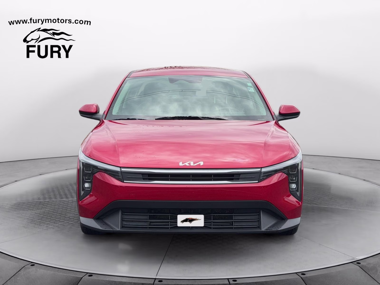 2025 Currant Red Kia K4 LXS FWD Sedan