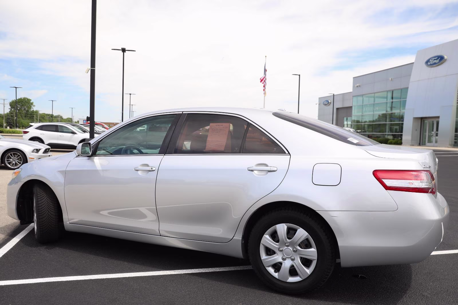 2010 Classic Silver Metallic Toyota Camry LE FWD Sedan