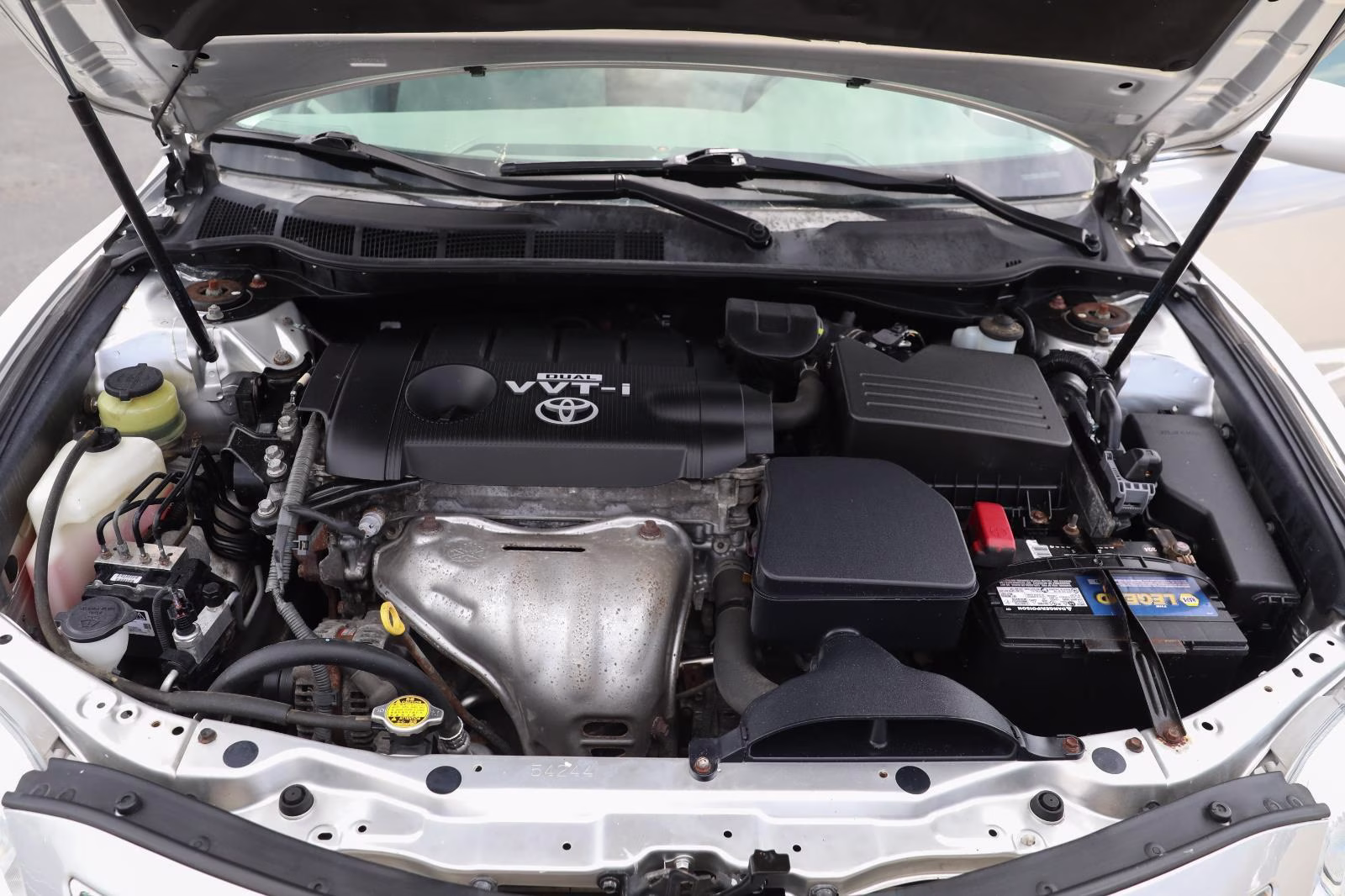 2010 Classic Silver Metallic Toyota Camry LE FWD Sedan