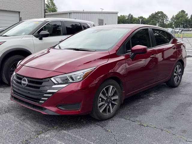 2024 Scarlet Ember Tintcoat Nissan Versa 1.6 SV FWD Sedan