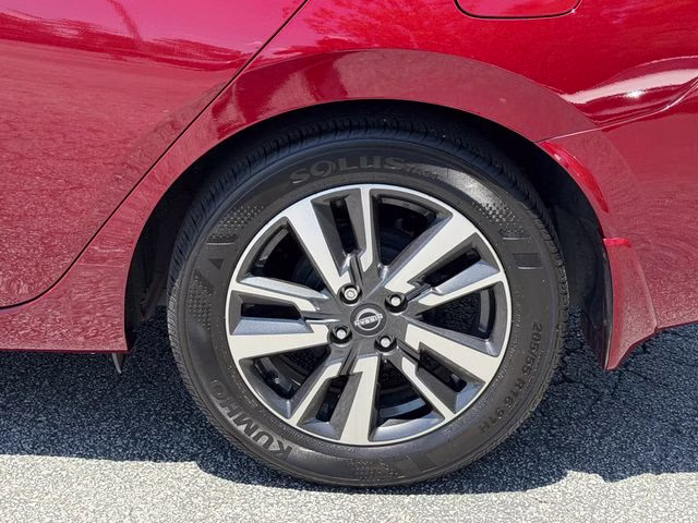 2024 Scarlet Ember Tintcoat Nissan Versa 1.6 SV FWD Sedan