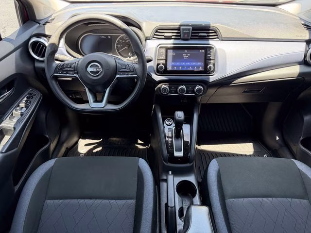 2024 Scarlet Ember Tintcoat Nissan Versa 1.6 SV FWD Sedan