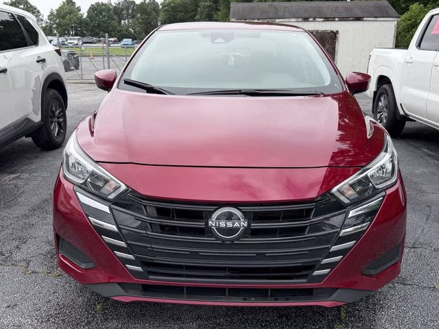2024 Scarlet Ember Tintcoat Nissan Versa 1.6 SV FWD Sedan
