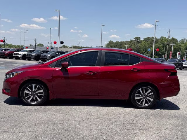 2024 Scarlet Ember Tintcoat Nissan Versa 1.6 SV FWD Sedan