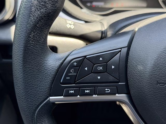 2024 Scarlet Ember Tintcoat Nissan Versa 1.6 SV FWD Sedan
