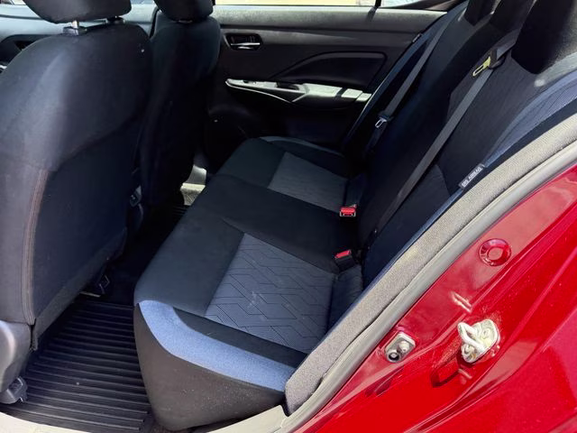 2024 Scarlet Ember Tintcoat Nissan Versa 1.6 SV FWD Sedan