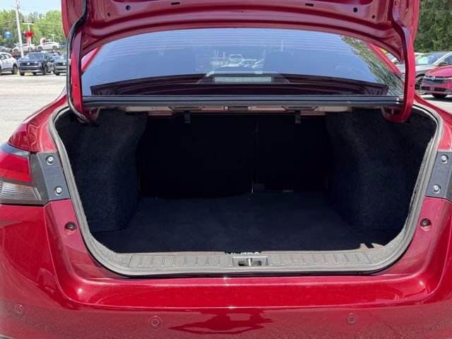 2024 Scarlet Ember Tintcoat Nissan Versa 1.6 SV FWD Sedan