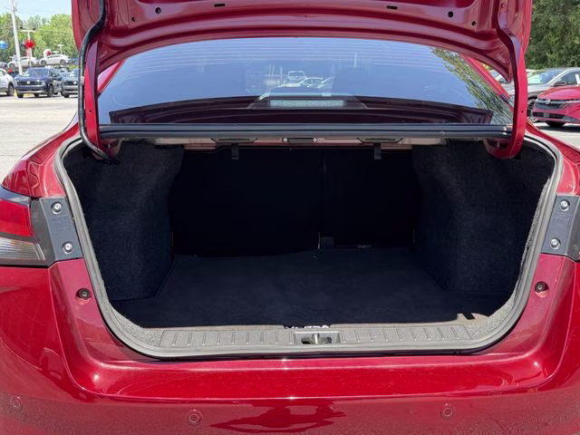 2024 Scarlet Ember Tintcoat Nissan Versa 1.6 SV FWD Sedan