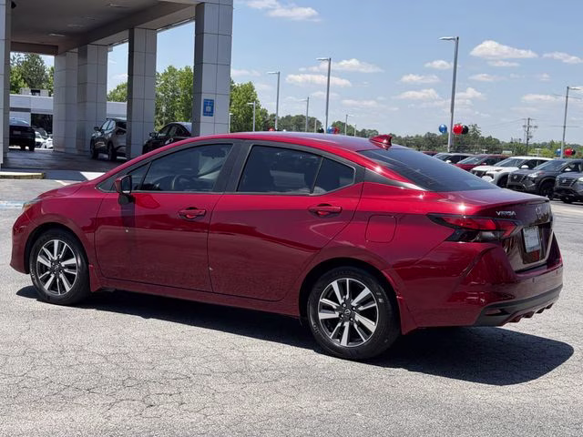2024 Scarlet Ember Tintcoat Nissan Versa 1.6 SV FWD Sedan
