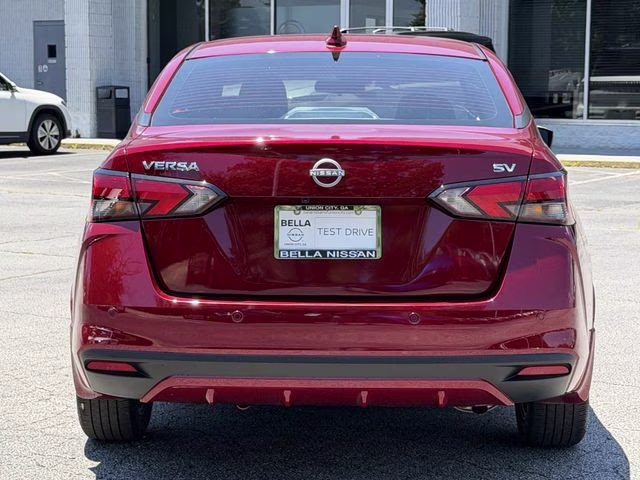 2024 Scarlet Ember Tintcoat Nissan Versa 1.6 SV FWD Sedan
