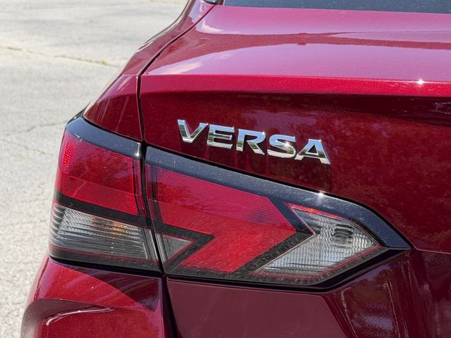 2024 Scarlet Ember Tintcoat Nissan Versa 1.6 SV FWD Sedan