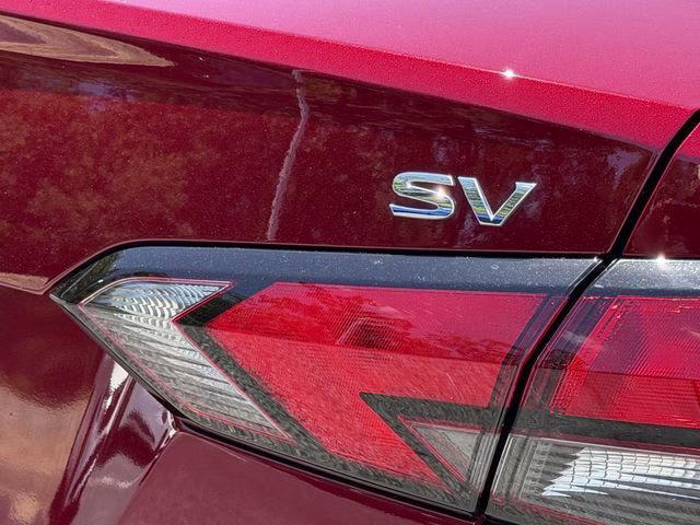 2024 Scarlet Ember Tintcoat Nissan Versa 1.6 SV FWD Sedan