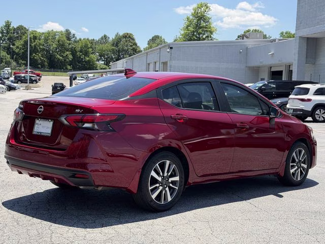 2024 Scarlet Ember Tintcoat Nissan Versa 1.6 SV FWD Sedan